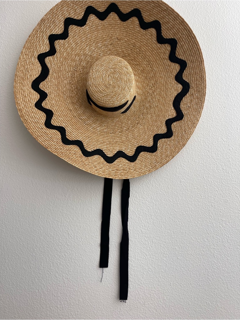 Extra wide straw beach hat with ric rac trim and grosgrain ribbon ties